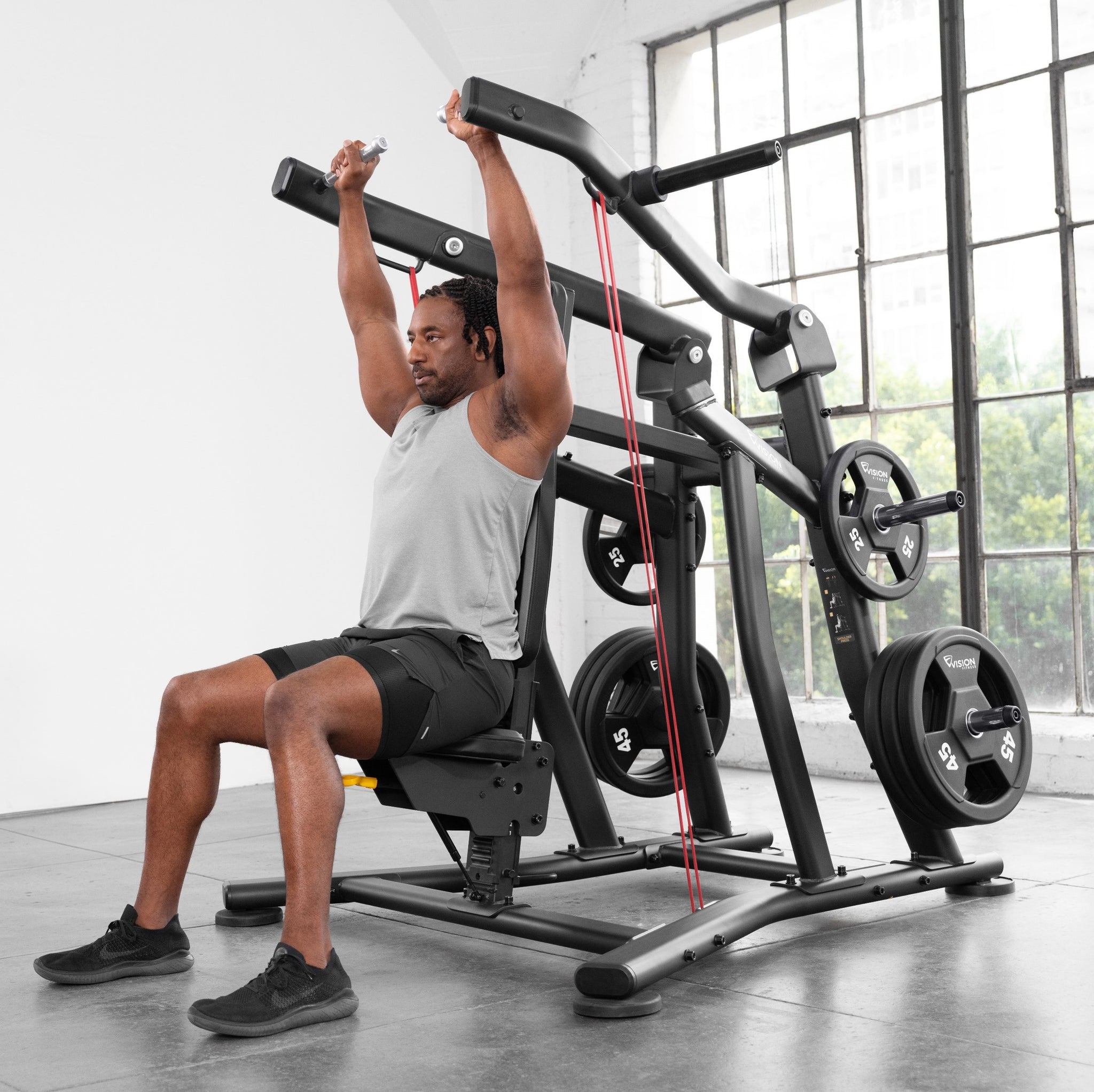 Schulterpresse Plate Load - Vision Fitness - einarmige (bilateral) Übungsausführung